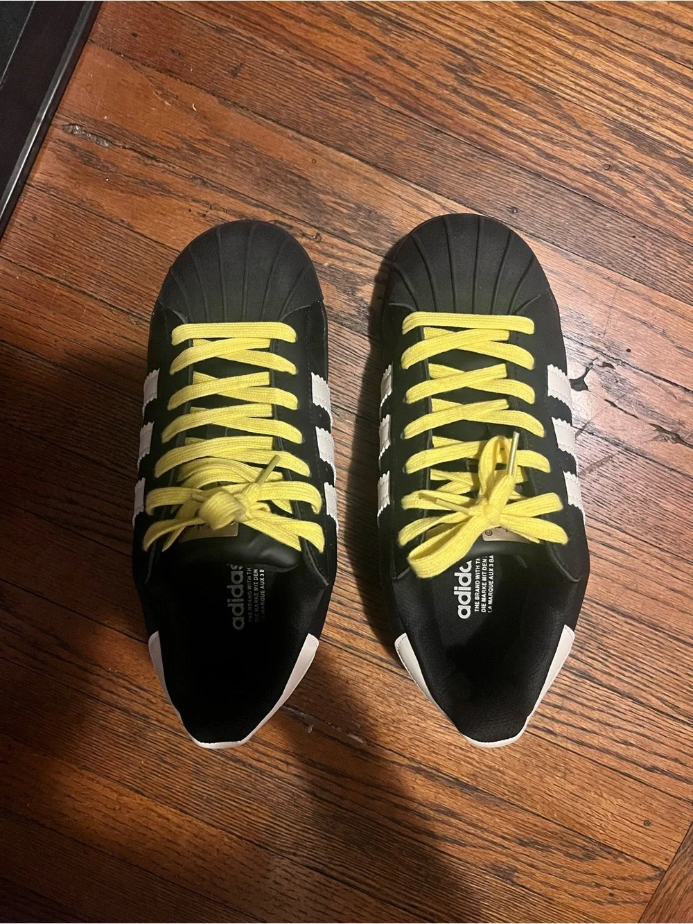 adidas Black Sneakers with Yellow Laces and White Stripes